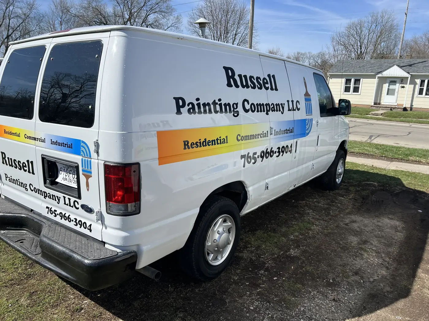Russell Painting Company LLC van lettered with the company name and phone number